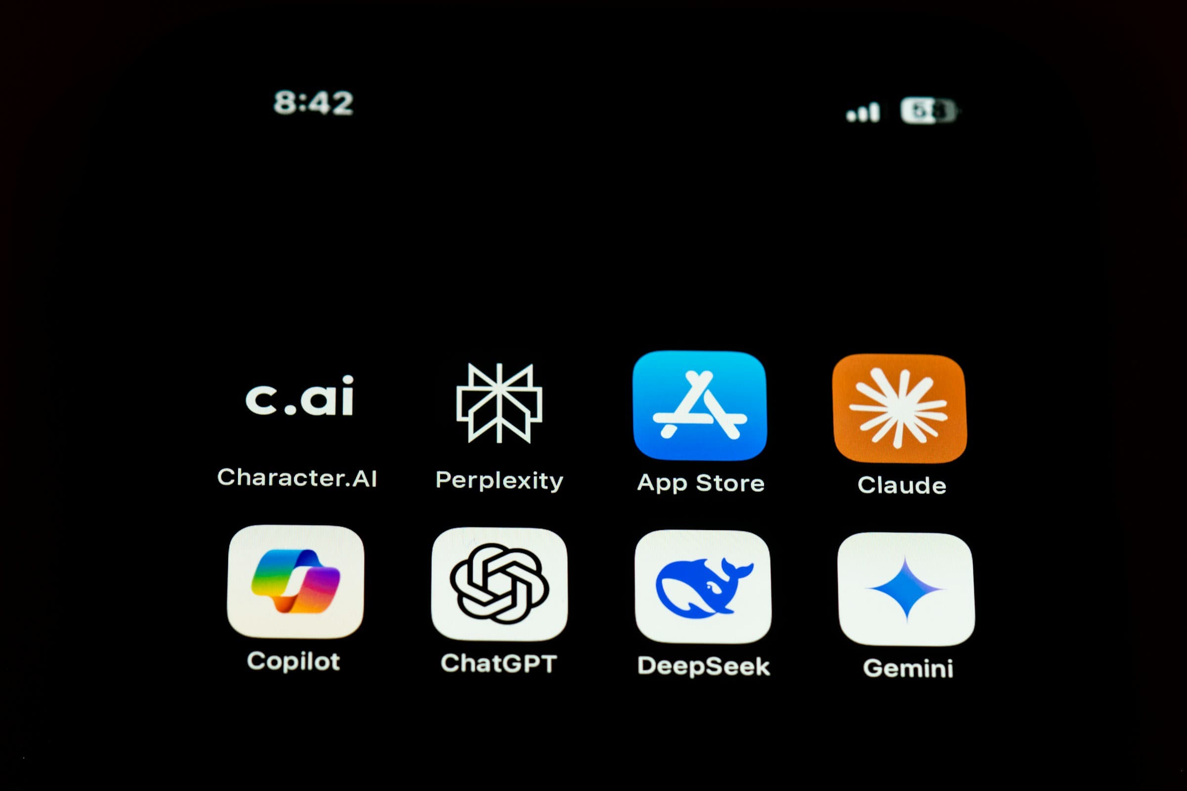 Claude, ChatGPT and Gemini app icons on a smartphone home screen