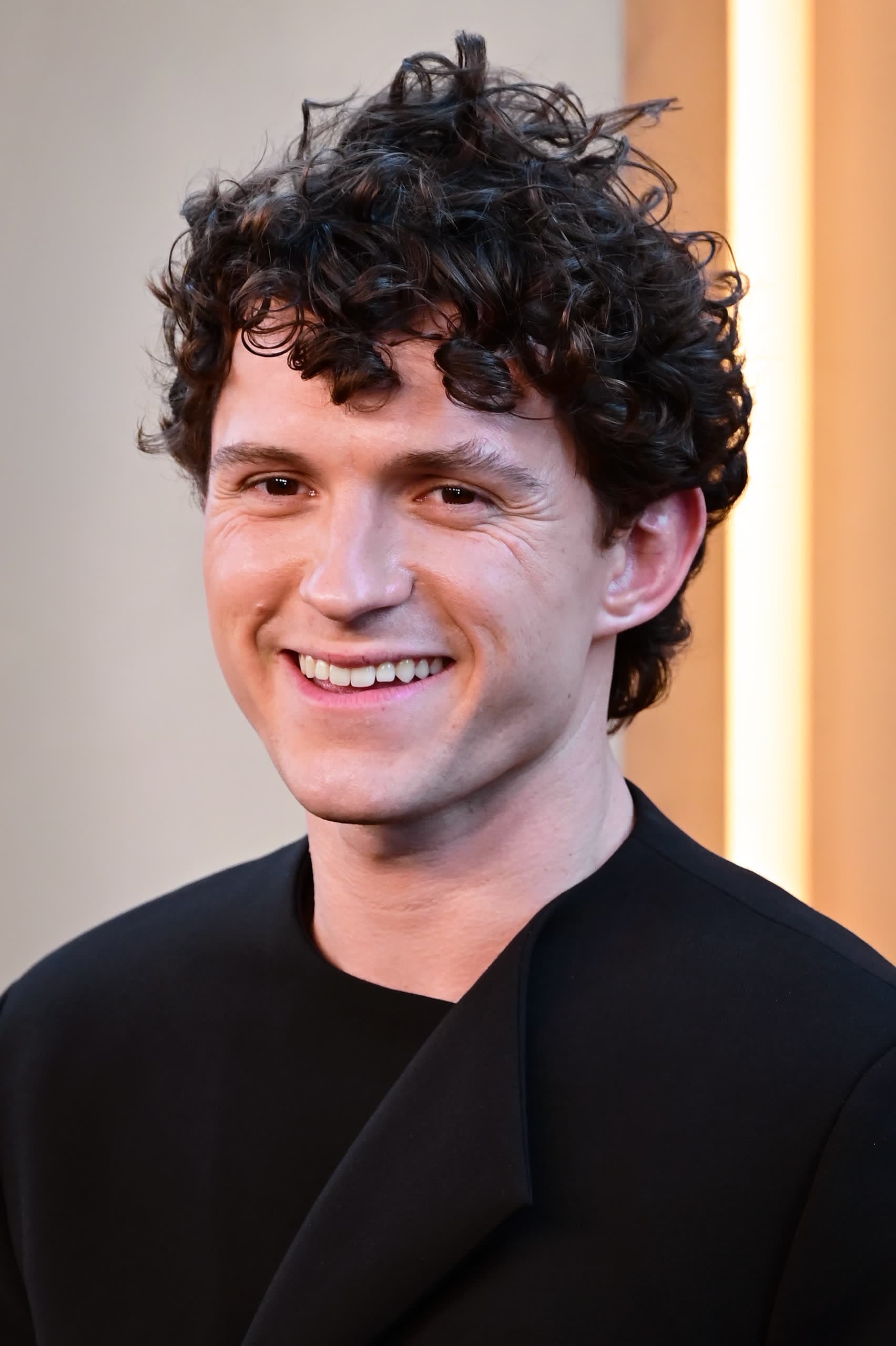 Tom Holland smiling at the New York premiere of The Odyssey in July 2026